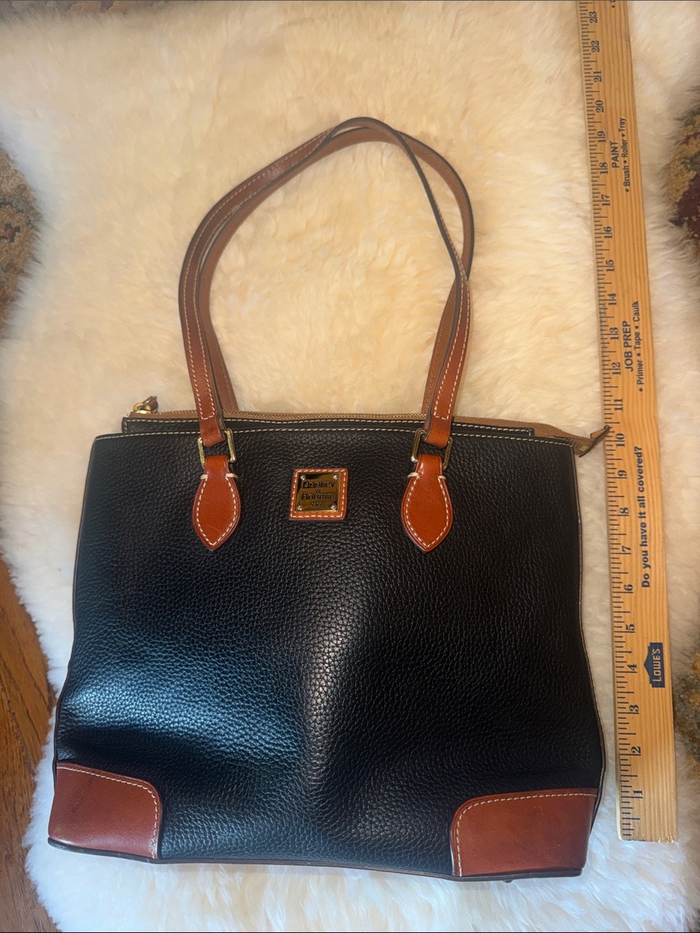 Dooney & Bourke Black with Brown Trim Pebbled Leather